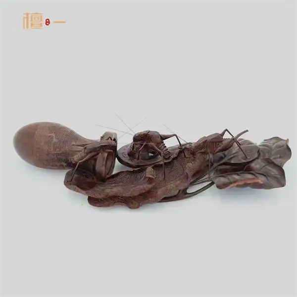 小叶紫檀木雕艺术价值_中国传统文化美追求_乌木雕刻摆件图片大全
